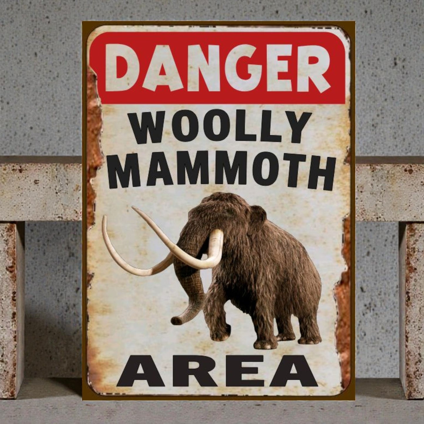 Vintage-style sign with a woolly mammoth illustration and 'Danger Woolly Mammoth Area' text.