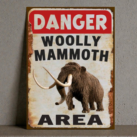 Vintage-style sign with a woolly mammoth illustration and 'Danger Woolly Mammoth Area' text on a gray background.