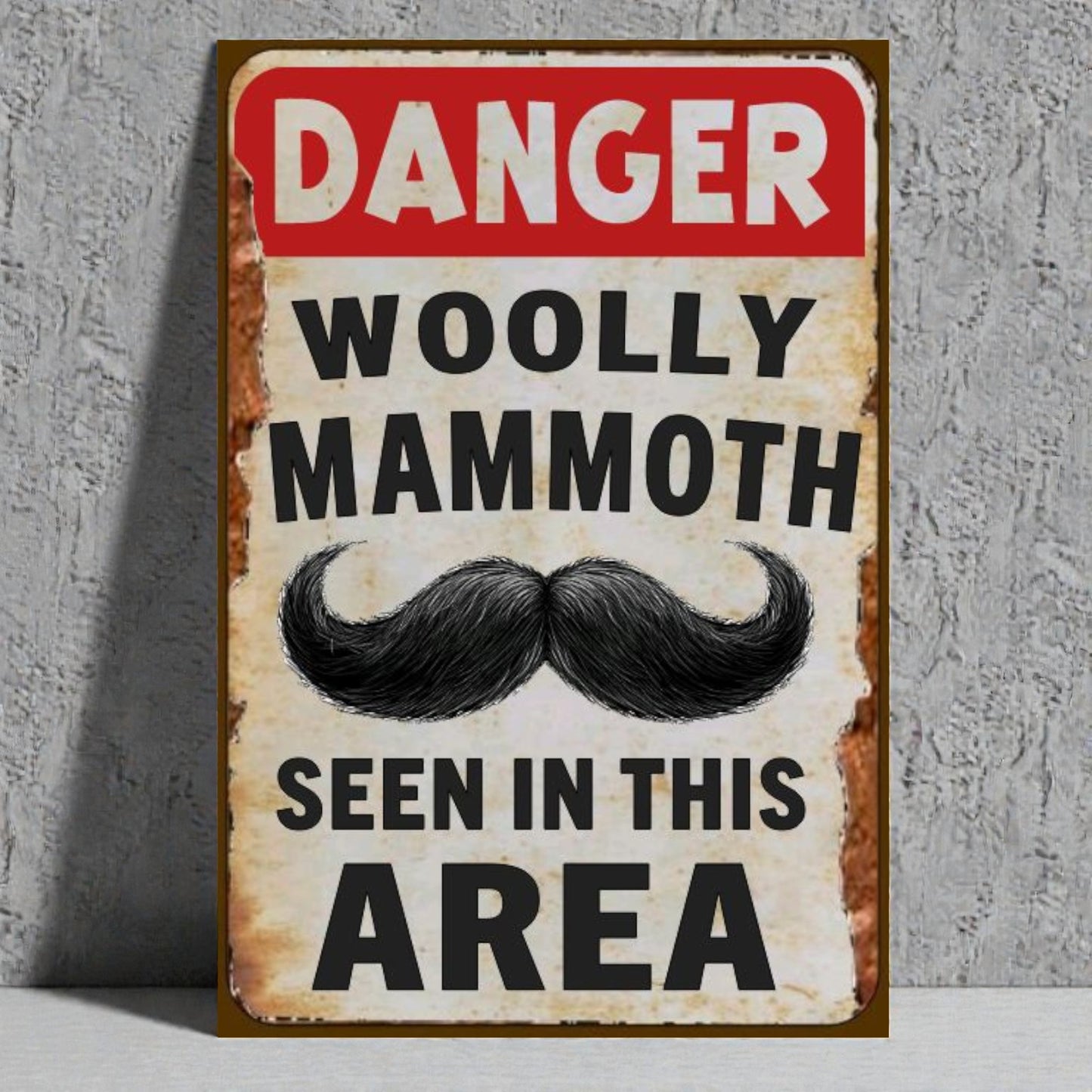 Vintage-style sign with a mustache graphic and text on a textured wall background