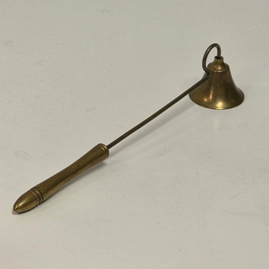 Antique solid brass candle snuffer with threaded handle and original patina.
