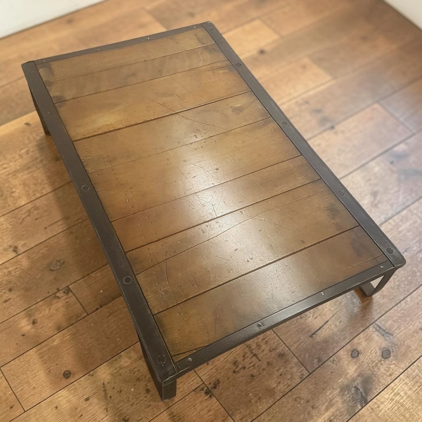 Authentic industrial factory pallet in wood and iron, perfect for coffee table or custom bar table conversion.