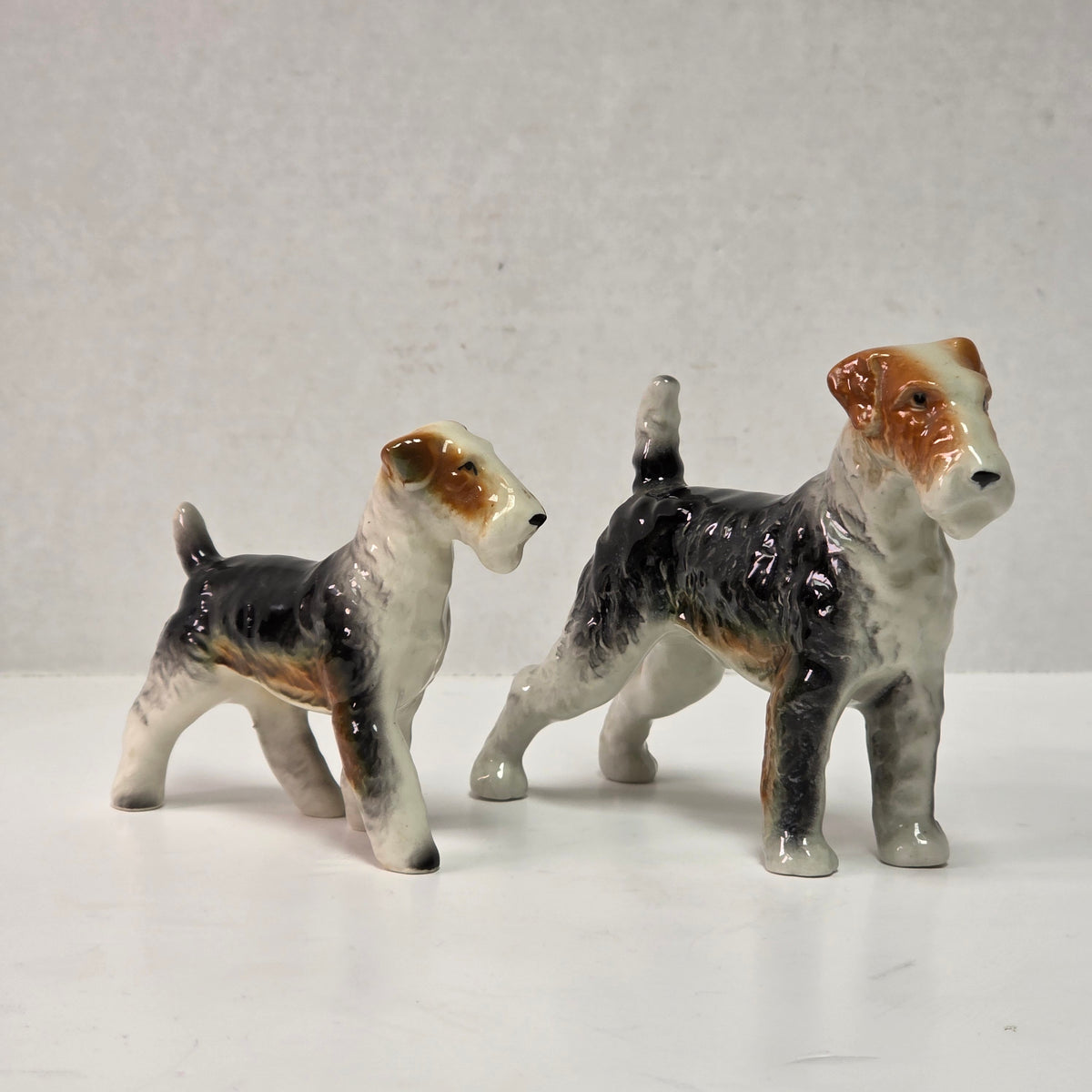 Antique hand-painted porcelain wire-haired terrier dog figurines
