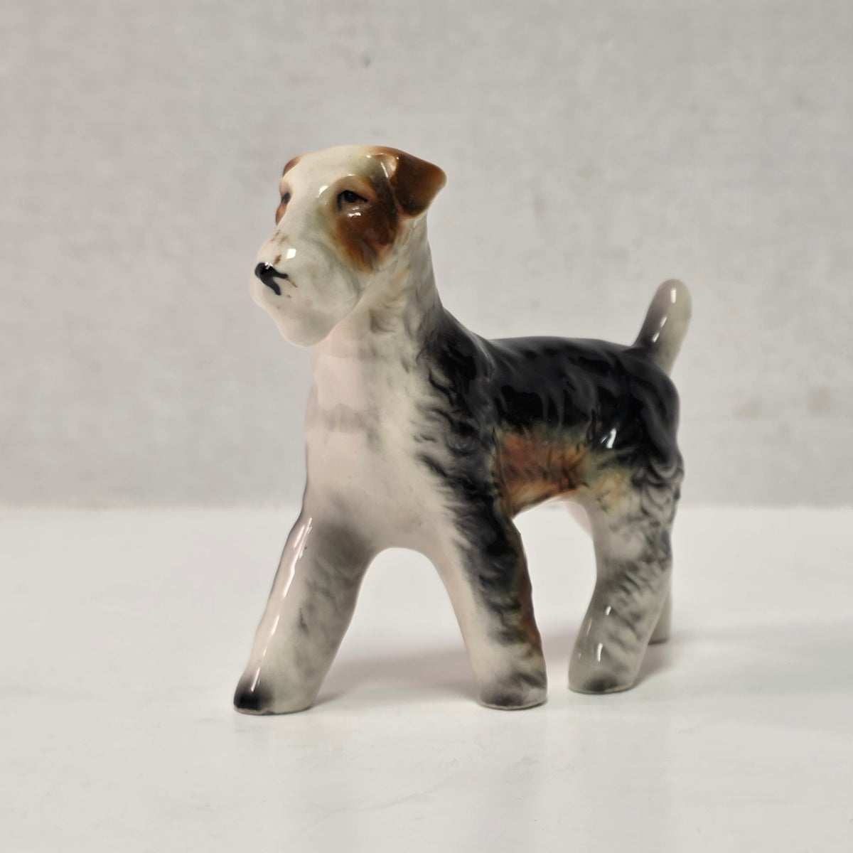 Antique hand-painted porcelain wire-haired terrier dog figurines
