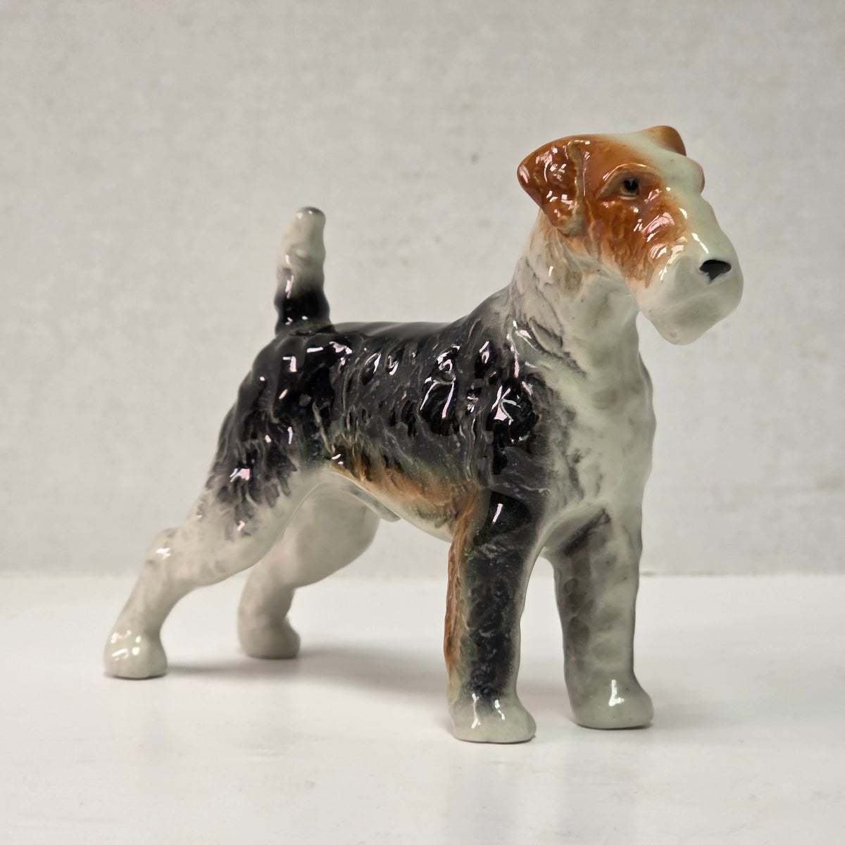 Antique hand-painted porcelain wire-haired terrier dog figurines
