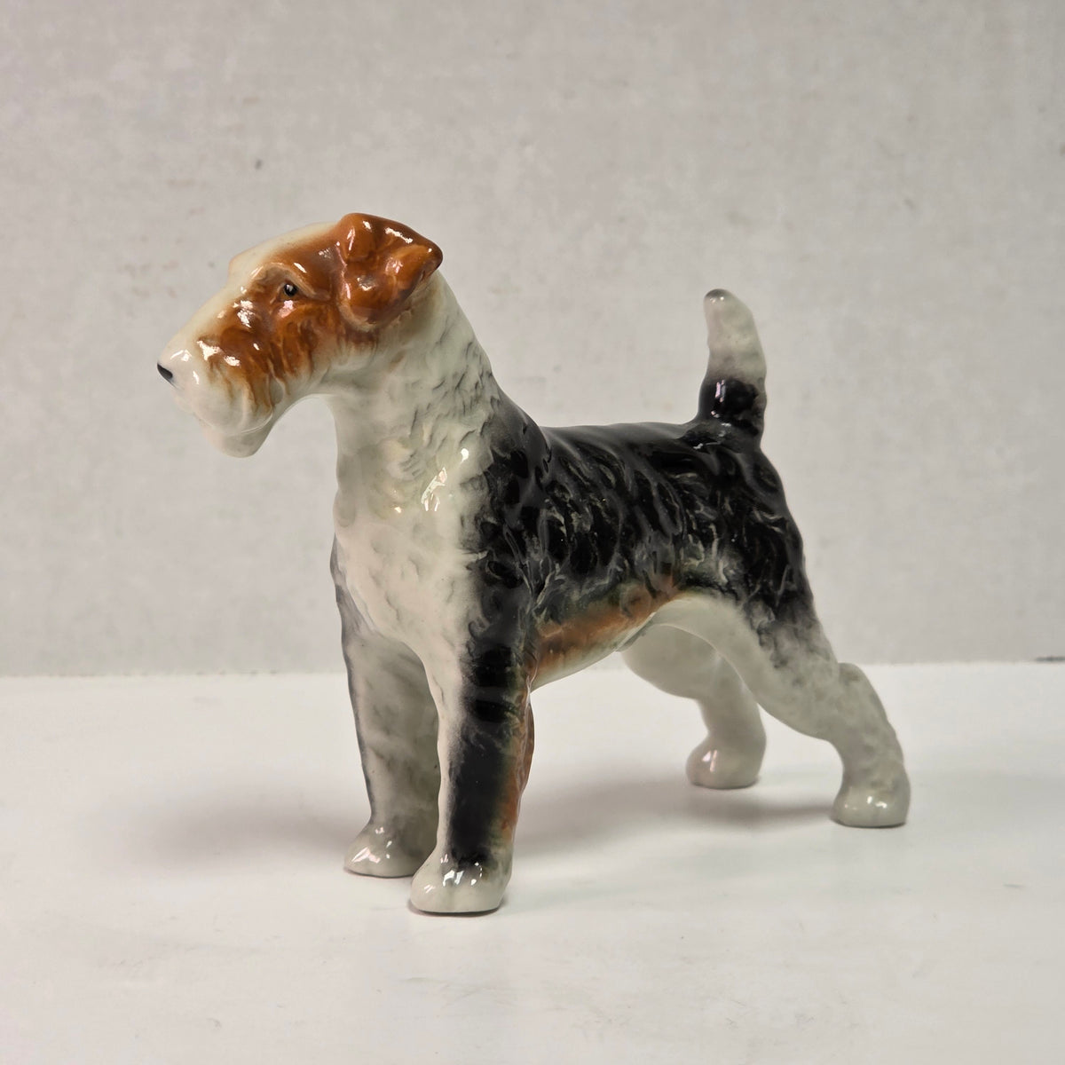 Antique hand-painted porcelain wire-haired terrier dog figurines

