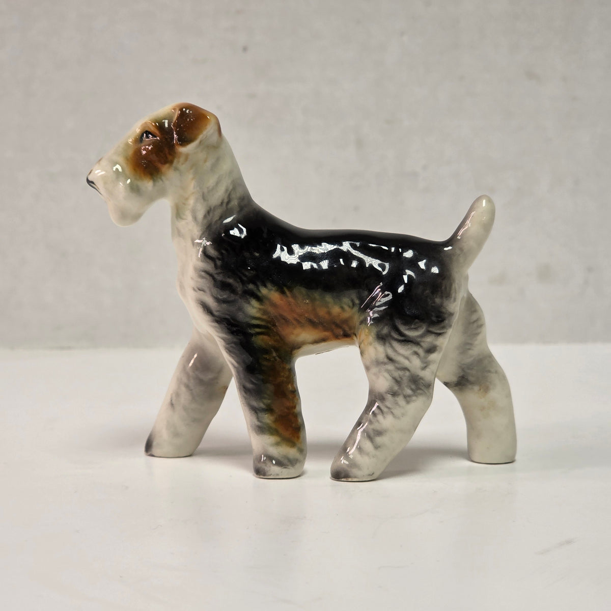 Antique hand-painted porcelain wire-haired terrier dog figurines
