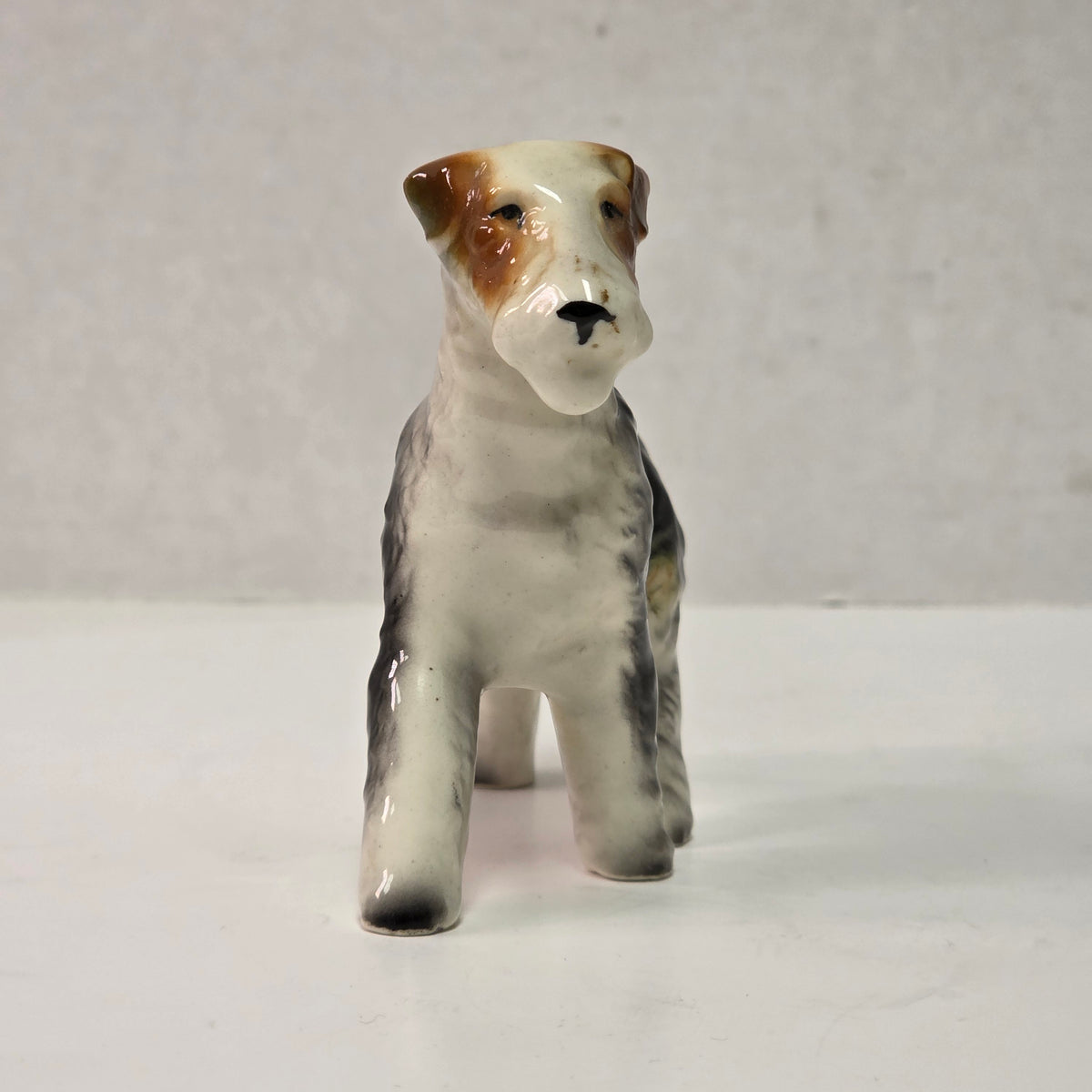 Antique hand-painted porcelain wire-haired terrier dog figurines
