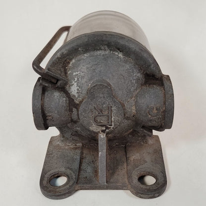 Antique glass fuel sediment bowl used on tractors and hit and miss engines for filtering fuel and separating water and debris.