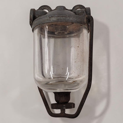 Antique glass fuel sediment bowl used on tractors and hit and miss engines for filtering fuel and separating water and debris.