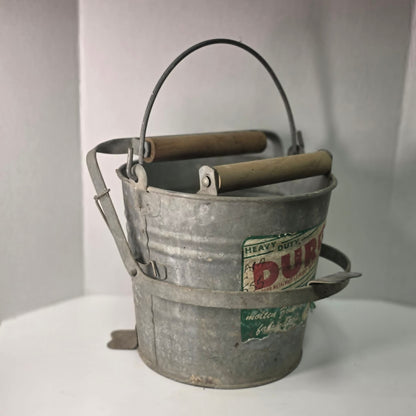 Antique Duro No. 24 galvanized wringer bucket with original label and price marking.