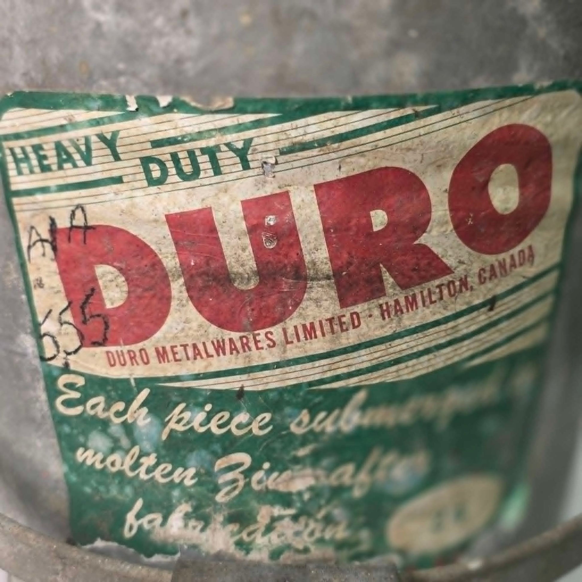 Antique Duro No. 24 galvanized wringer bucket with original label and price marking.