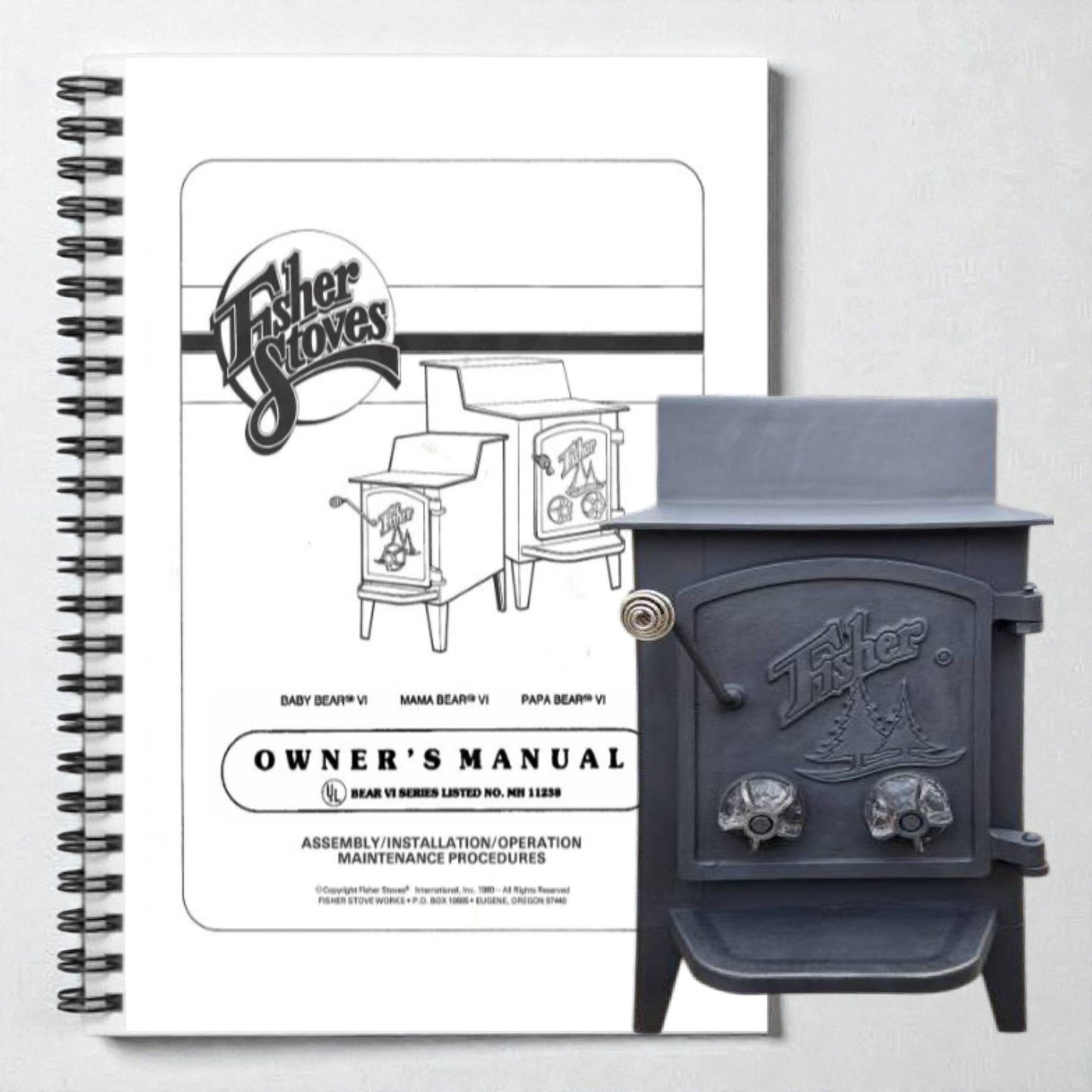 Fisher Stoves owner's manual next to a black stove on a white background