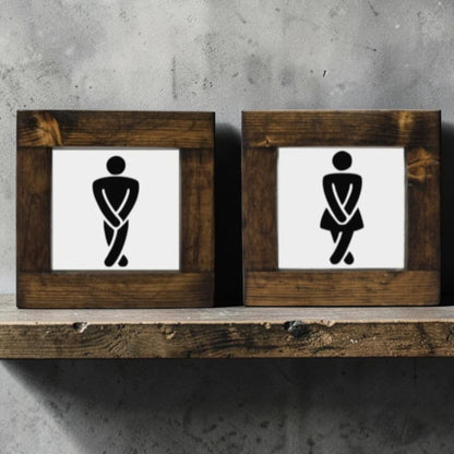 Handmade men's and women's bathroom signs with humorous crossing legs figures.
