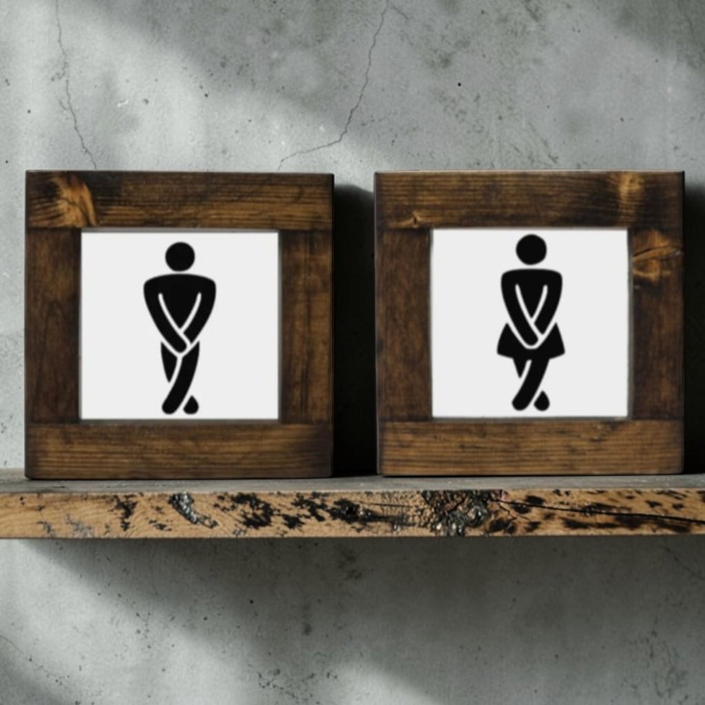 Handmade men's and women's bathroom signs with humorous crossing legs figures.
