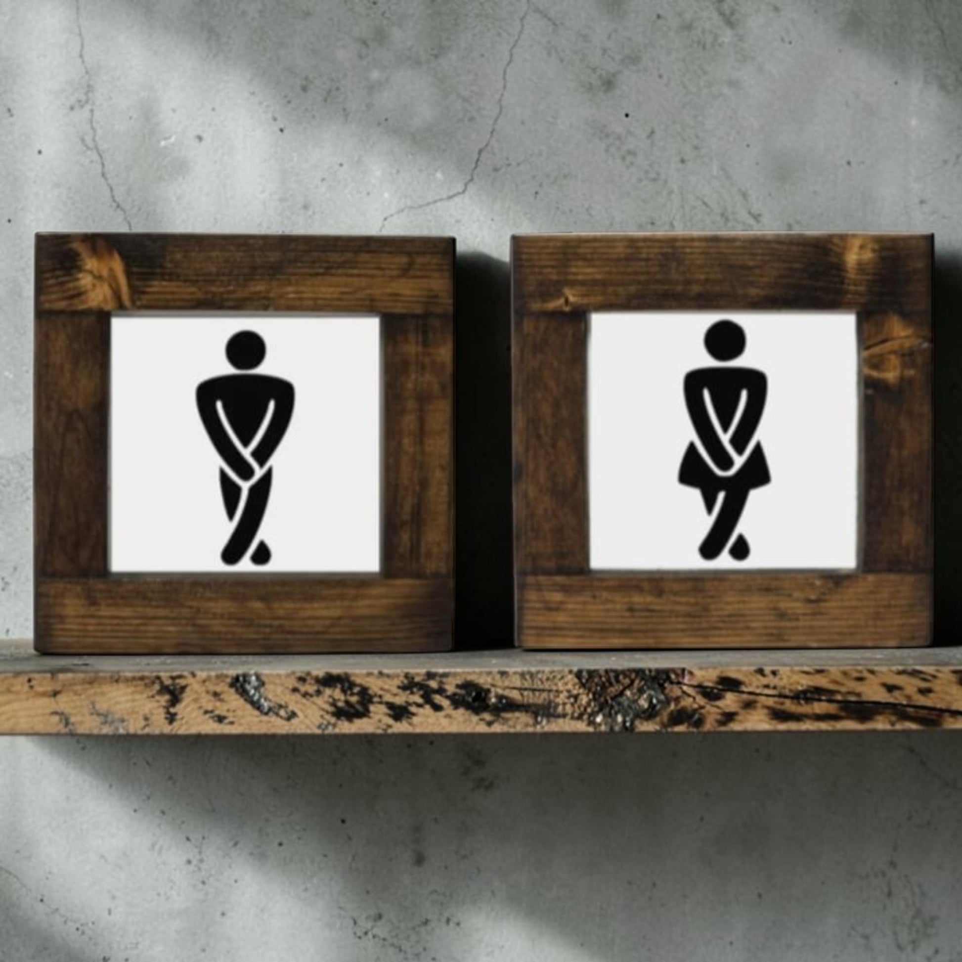 Handmade men's and women's bathroom signs with humorous crossing legs figures.
