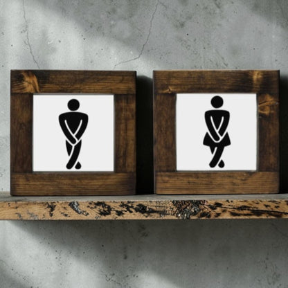 Handmade men's and women's bathroom signs with humorous crossing legs figures.

