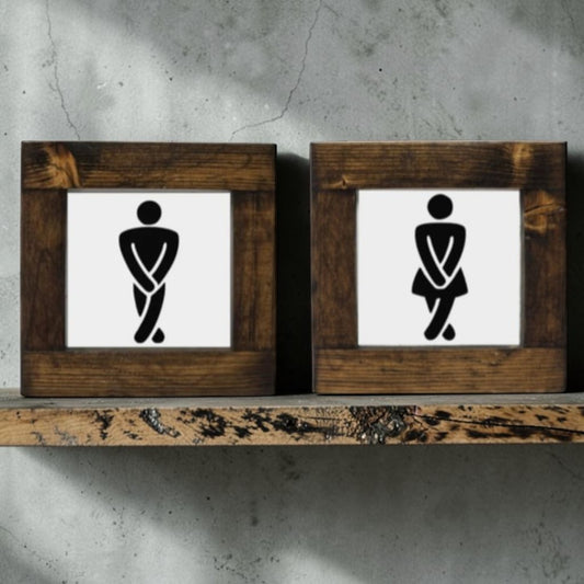 Handmade men's and women's bathroom signs with humorous crossing legs figures.
