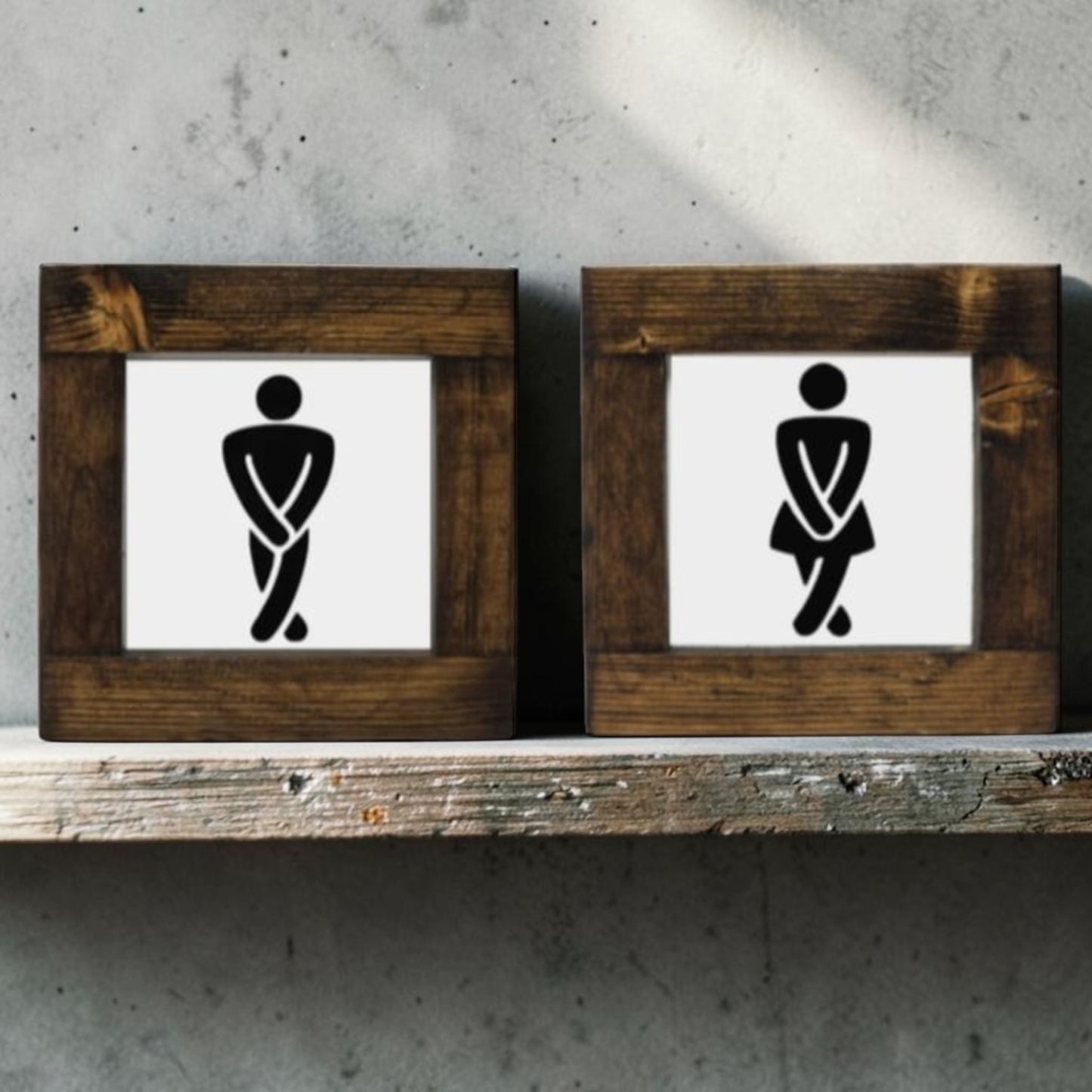 Handmade men's and women's bathroom signs with humorous crossing legs figures.
