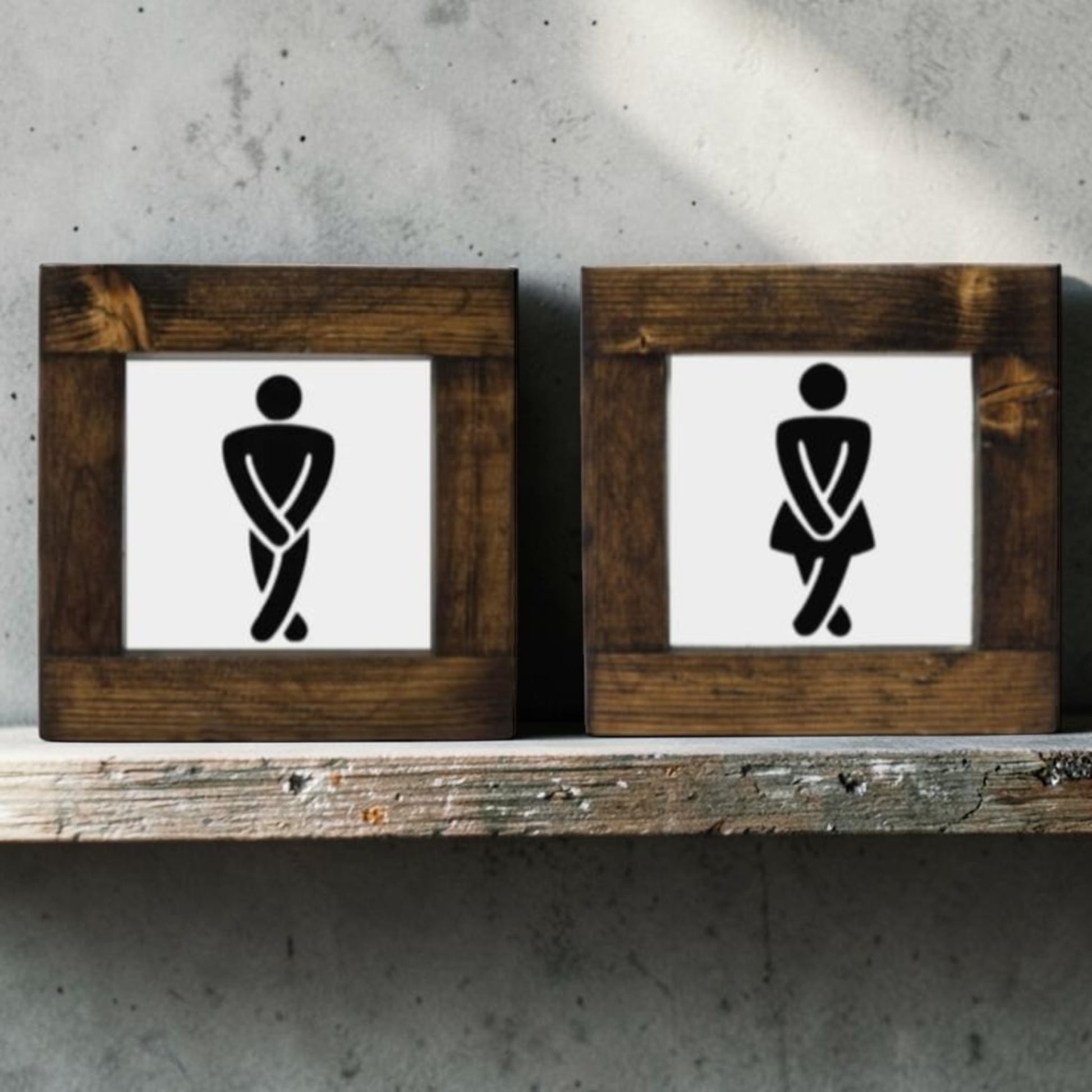 Handmade men's and women's bathroom signs with humorous crossing legs figures.
