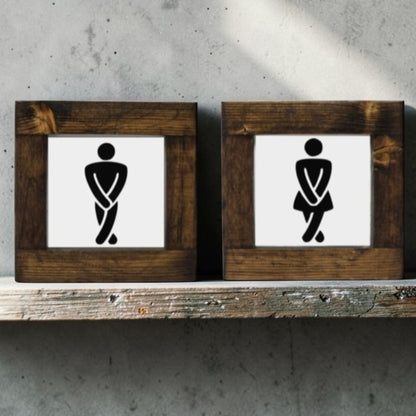 Handmade men's and women's bathroom signs with humorous crossing legs figures.
