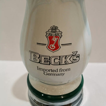 Classic Beck’s Beer porcelain keg head with dual spouts, ideal for bar or brewery display.