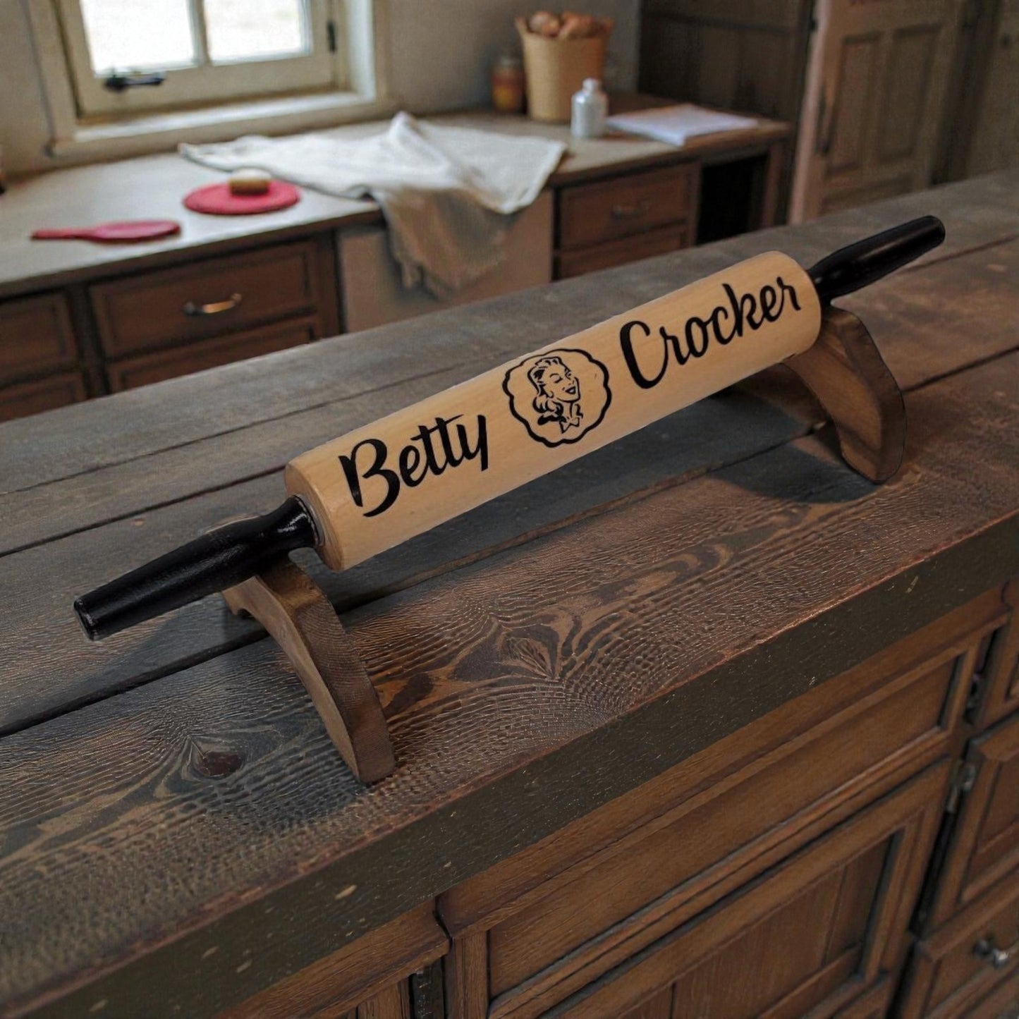 Wooden rolling pin with 'Betty Crocker' branding on a wooden surface.