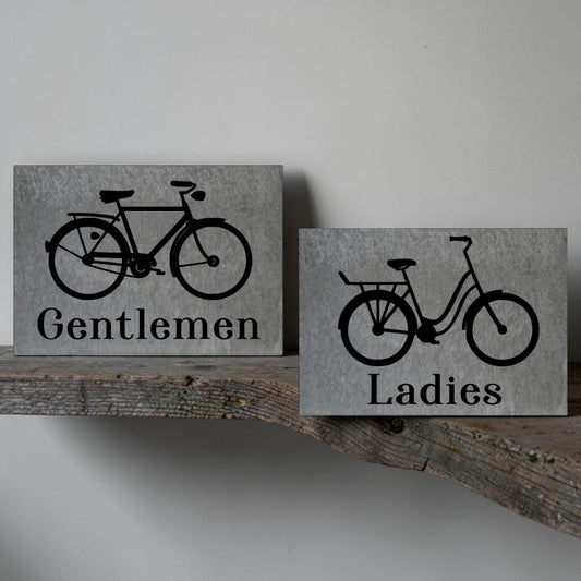 Ladies bicycle bathroom sign
Gentlemen bicycle bathroom sign
Barn tin restroom sign set
Antique bike wall decor sign
Rustic metal bathroom signage