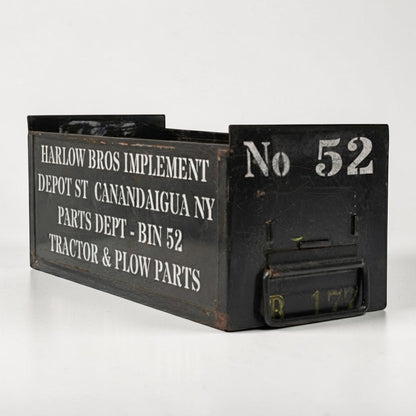 Vintage army green industrial metal parts bin with stenciled lettering and front label slot.

