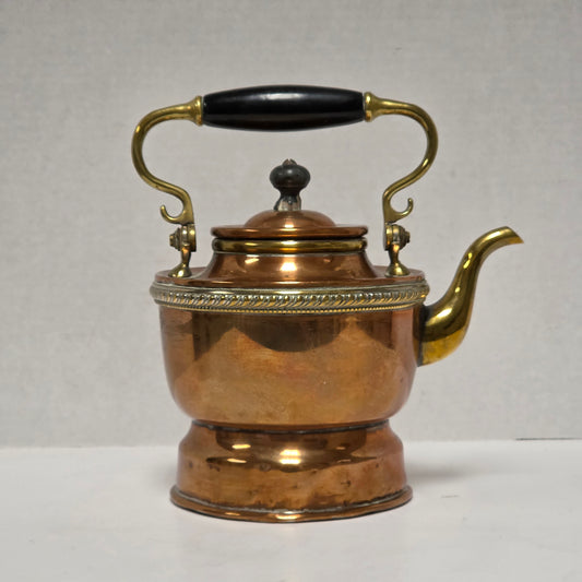 Ornate Victorian copper and brass teapot with ebonized handle
