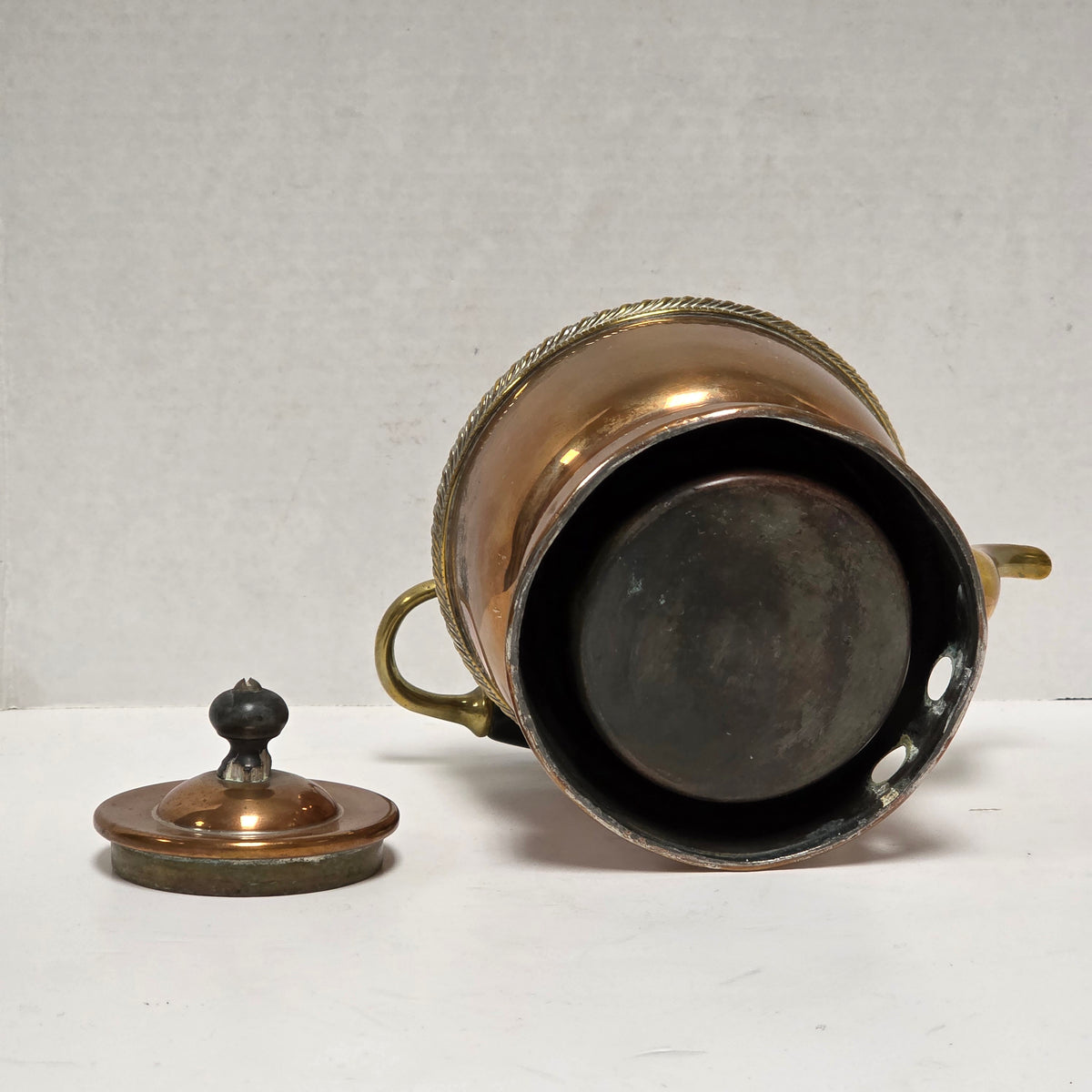 Ornate Victorian copper and brass teapot with ebonized handle
