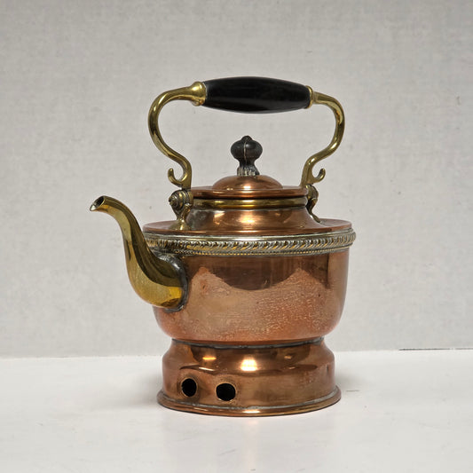 Ornate Victorian copper and brass teapot with ebonized handle
