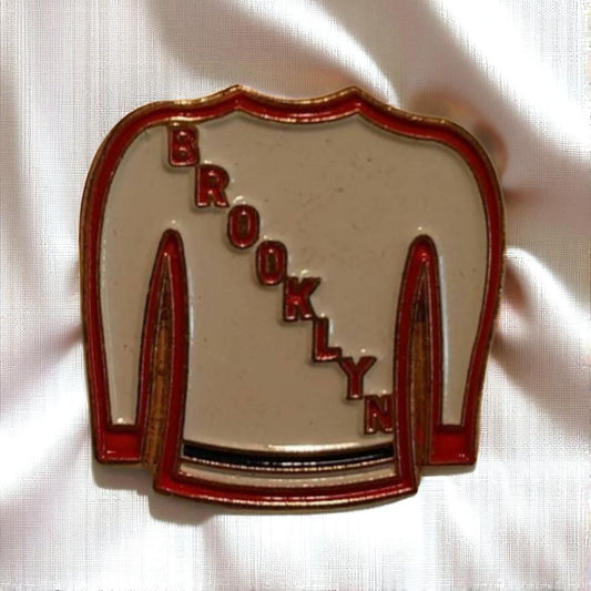 Brooklyn-themed badge with red text on a white background