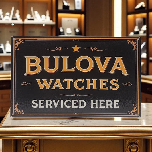 Bulova watches serviced here sign on a counter with a store interior background