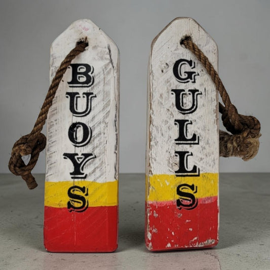 Hand-painted lobster buoy Boys and Girls bathroom signs made from reclaimed wood.
