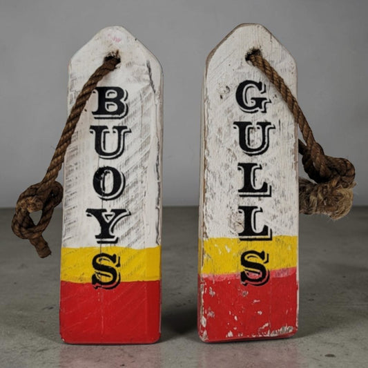 Hand-painted lobster buoy Boys and Girls bathroom signs made from reclaimed wood.
