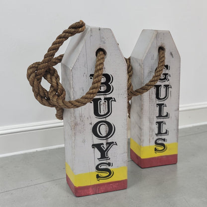 Hand-painted lobster buoy Boys and Girls bathroom signs made from reclaimed wood.
