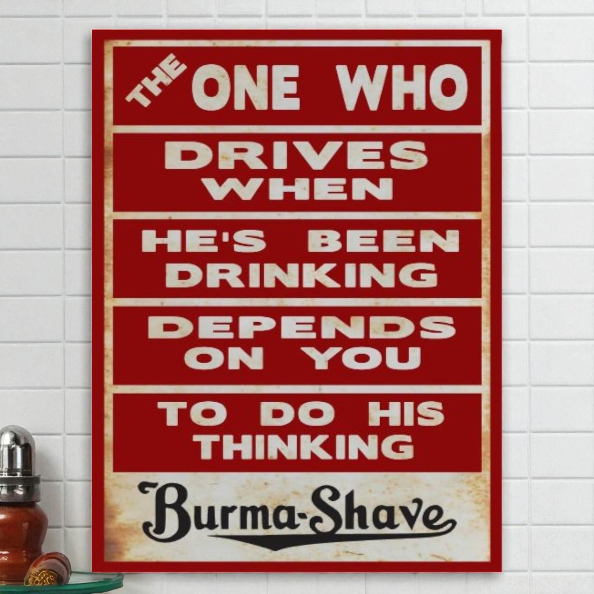 Vintage-style sign with humorous text on a white tiled wall, featuring the brand 'Burma-Shave'.