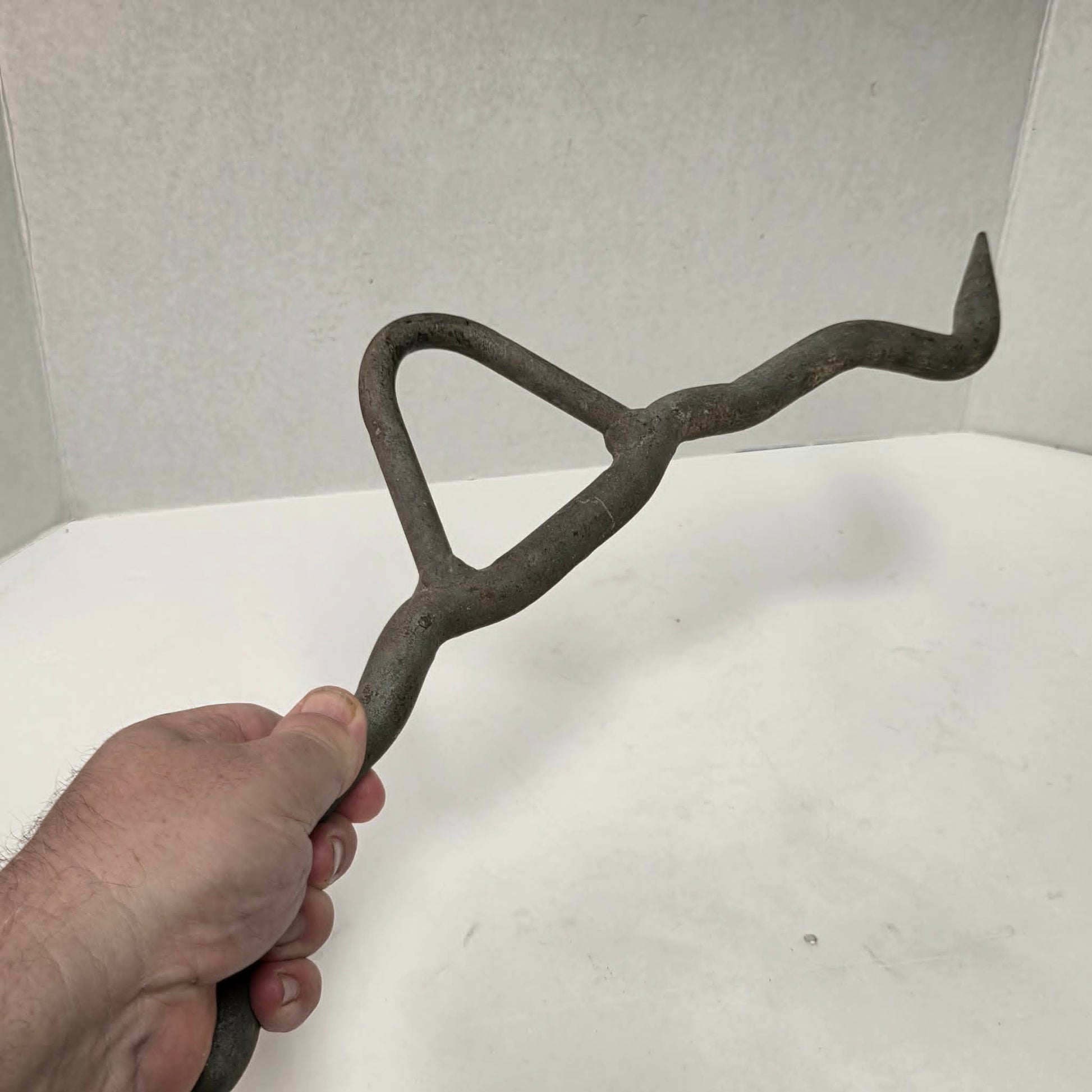 Heavy-duty professional butcher's gambrel hook for hanging deer, hogs, and large game during processing.
