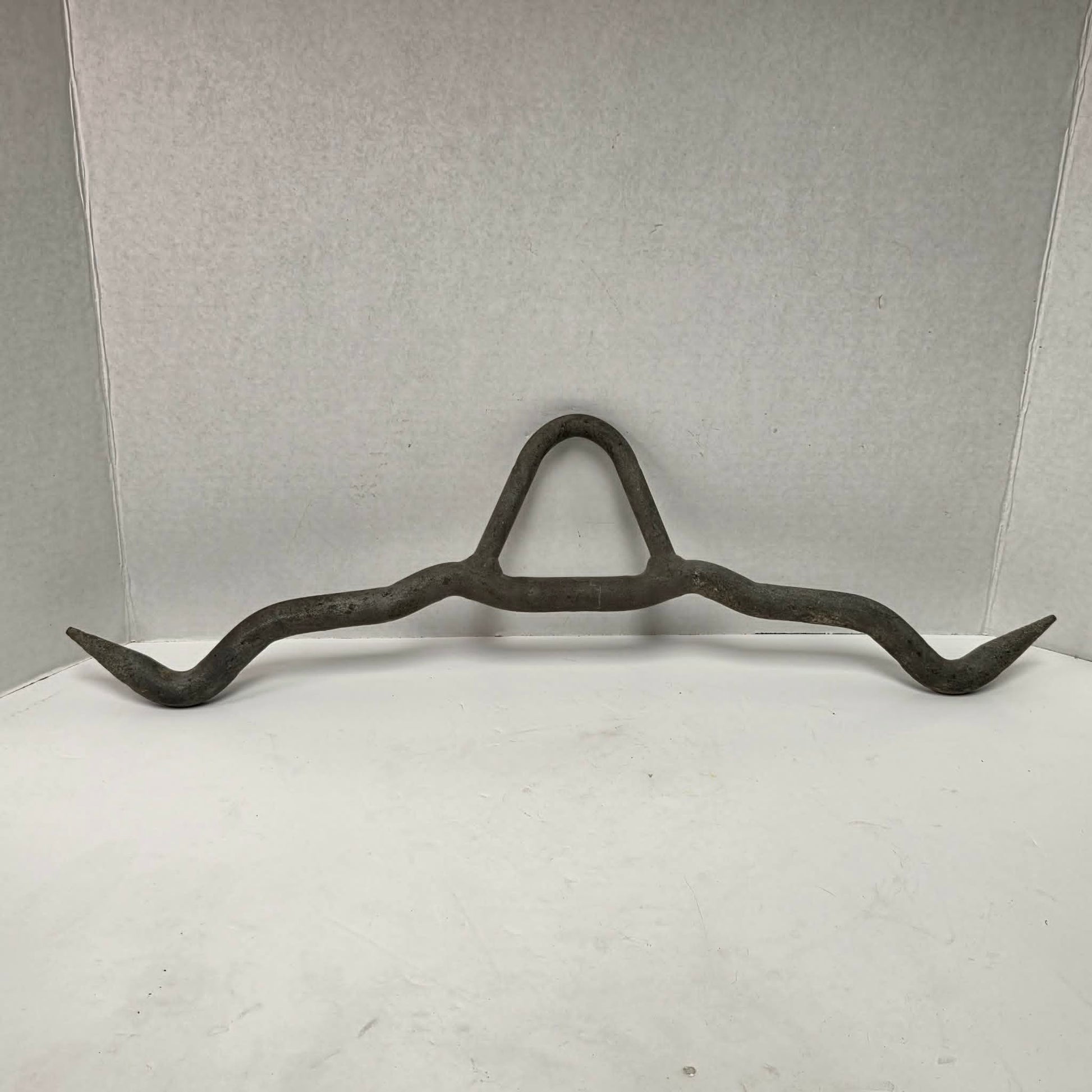 Heavy-duty professional butcher's gambrel hook for hanging deer, hogs, and large game during processing.
