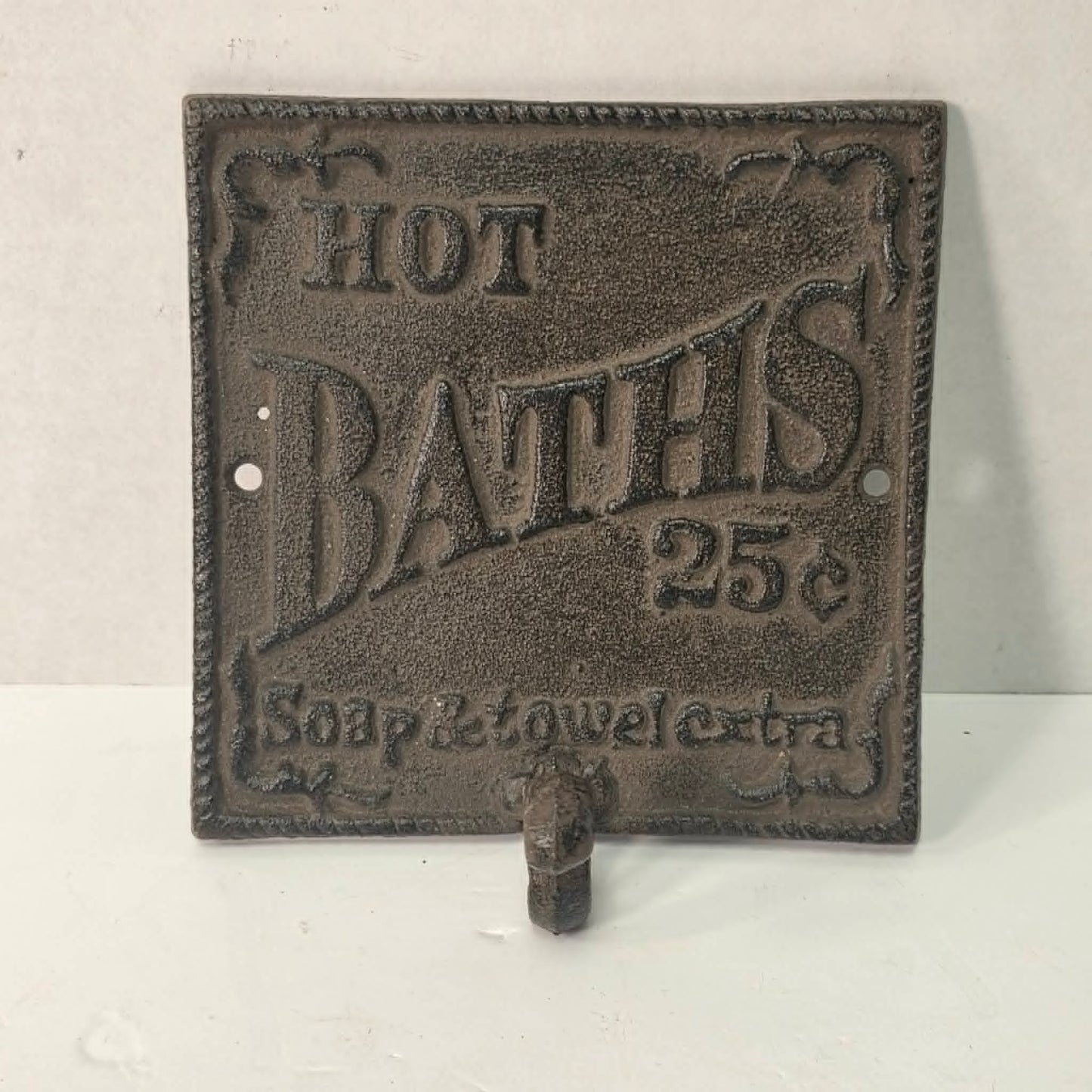 Cast iron bathroom sign with hook – hot baths, soap & towel extra