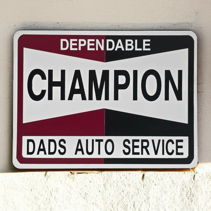 Metal sign with 'Dependable Champion Dads Auto Service' text on a white background