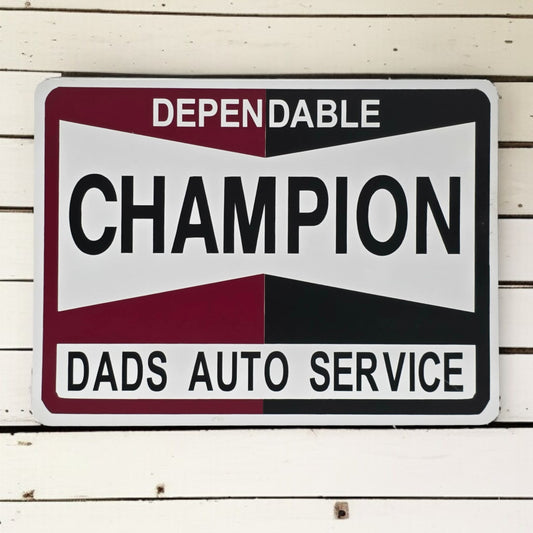 Metal sign with 'Dependable Champion Dads Auto Service' text on a wooden background