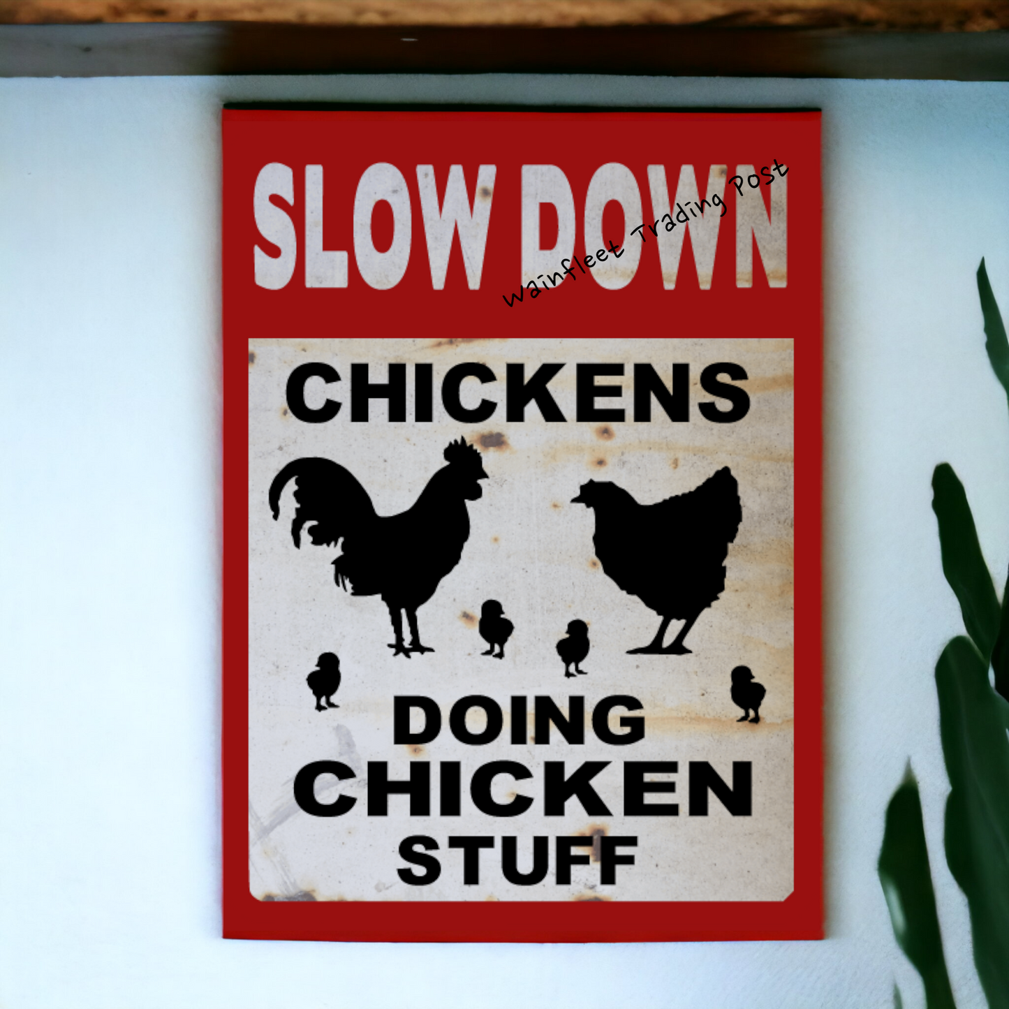 slow down sign chickens doing chicken stuff