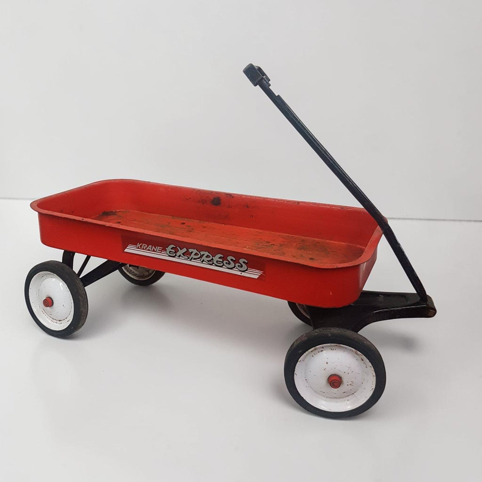 Red toy wagon with 'Express' branding on a white background