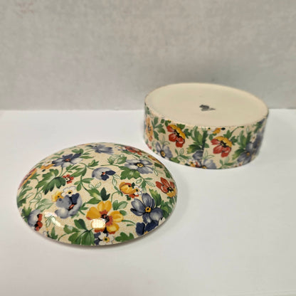 Antique English Chintz porcelain powder jar with floral design in excellent condition.
