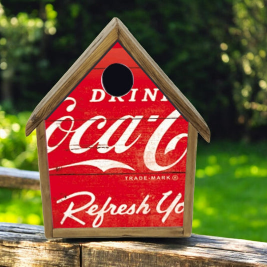 Handcrafted Coca-Cola birdhouse made from reclaimed wood with metal Drink Coca-Cola front.
