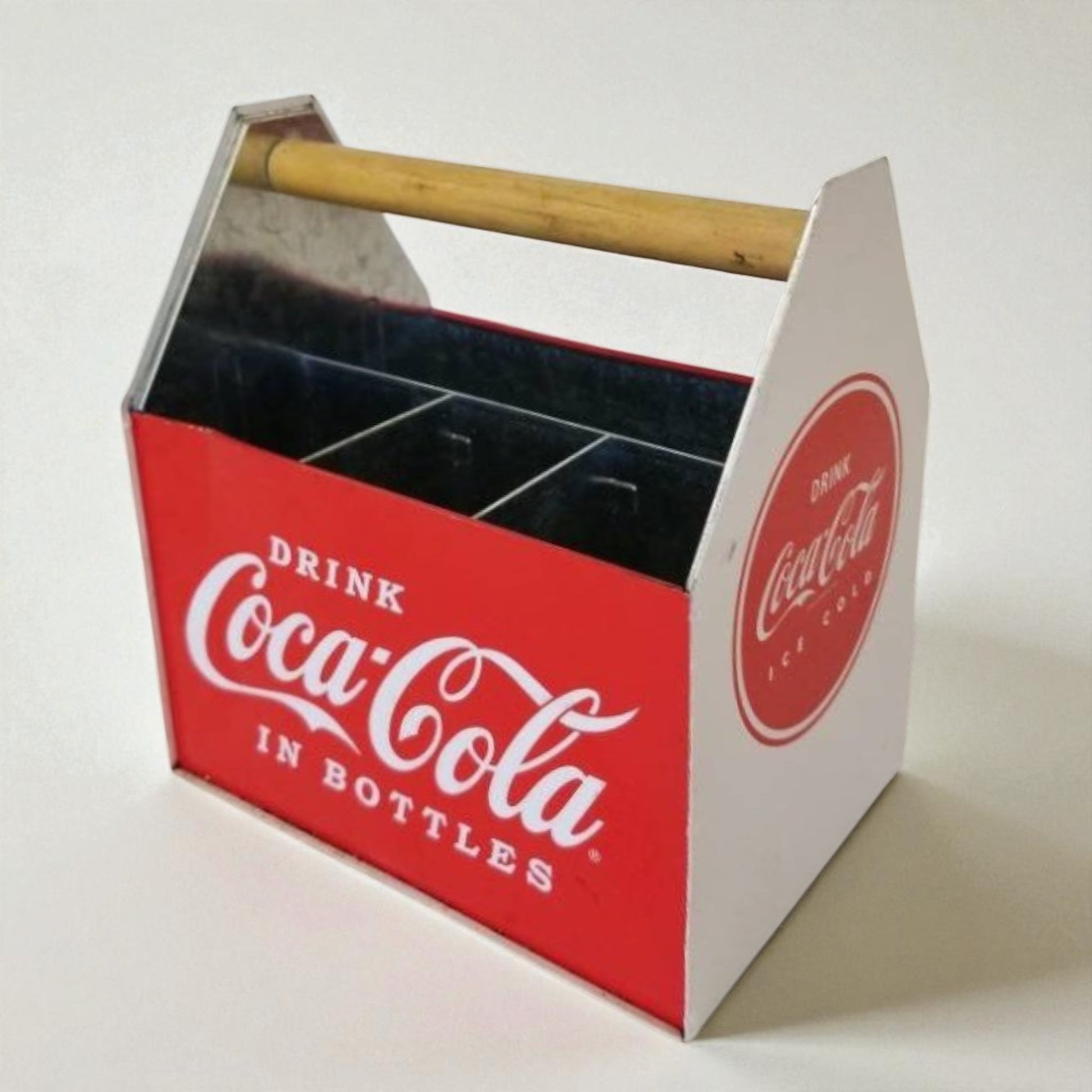 Coca-Cola bottle carrier with wooden handle on a white background