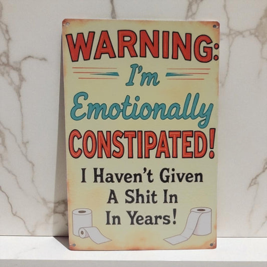 Metal sign with humorous text and toilet paper graphics on a marble background