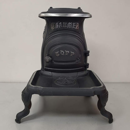 Antique Copp compact cast iron box stove designed for marine and railroad use, 24x12x19 inches.
