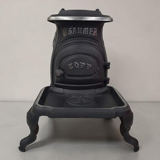 Antique Copp compact cast iron box stove designed for marine and railroad use, 24x12x19 inches.